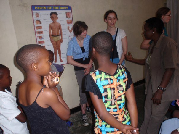 Samantha learning hands, shoulders, knees and toes song in Kinyarawanda