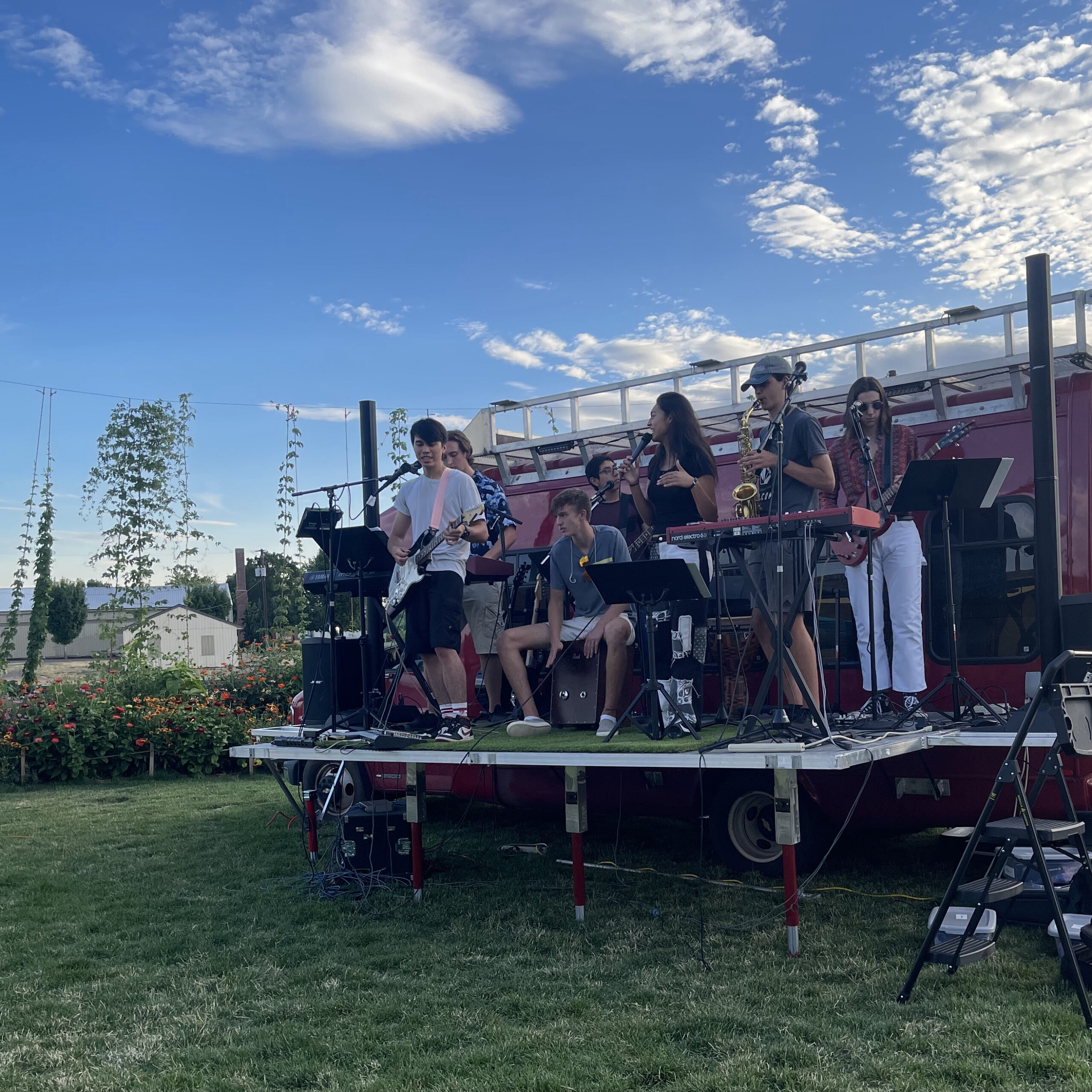 Students playing music on the Big Red Bus stage