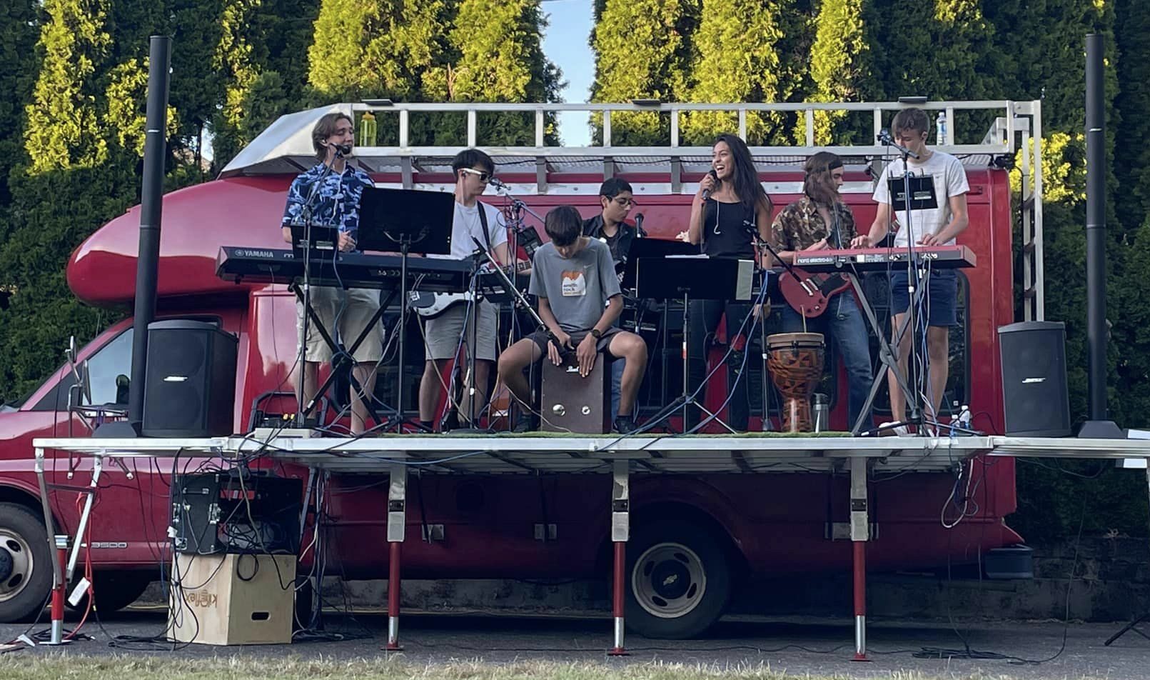 Students playing music on the Big Red Bus stage